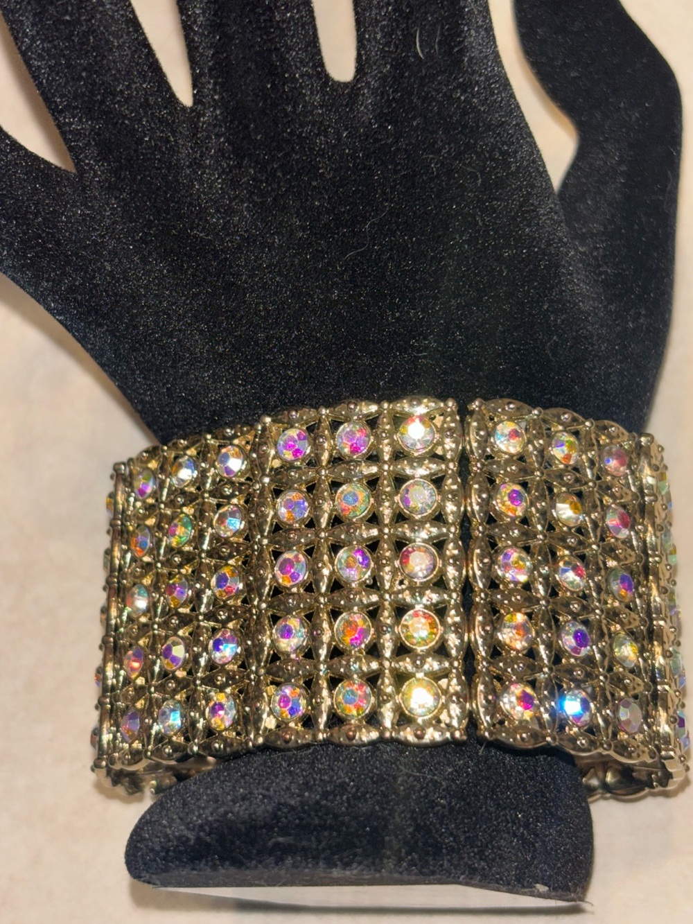 NWOT stretch bracelet, gold-toned with multicolored rhinestones, very sparkly!